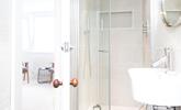 The modern en suite has a shower, WC and basin. - Thumbnail Image
