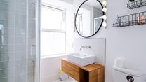 The sleek modern shower room is a stylish space to get ready.