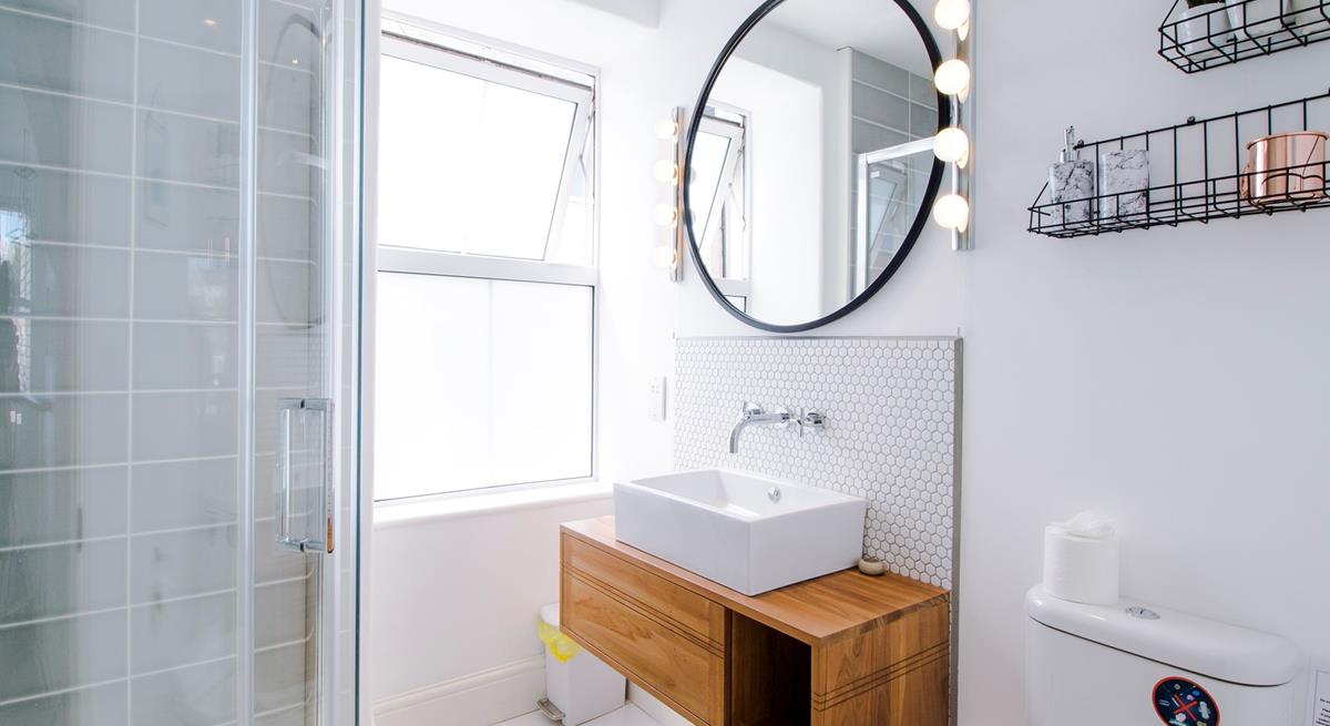 The sleek modern shower room is a stylish space to get ready.