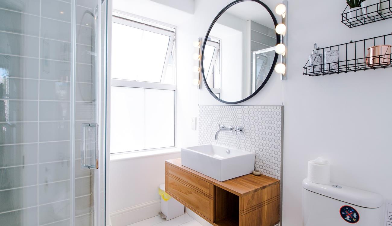 The sleek modern shower room is a stylish space to get ready.