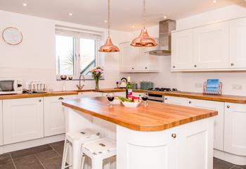 Beautifully appointed kitchen with island and seating for 2.