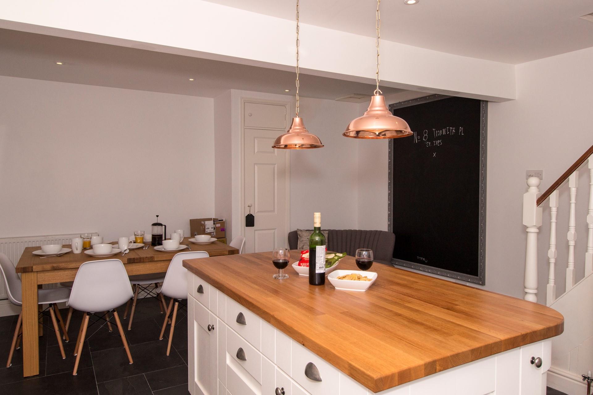 The open plan kitchen/dining area is a great space to entertain whilst dinner is cooking. 