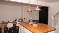 The open plan kitchen/dining area is a great space to entertain whilst dinner is cooking. 