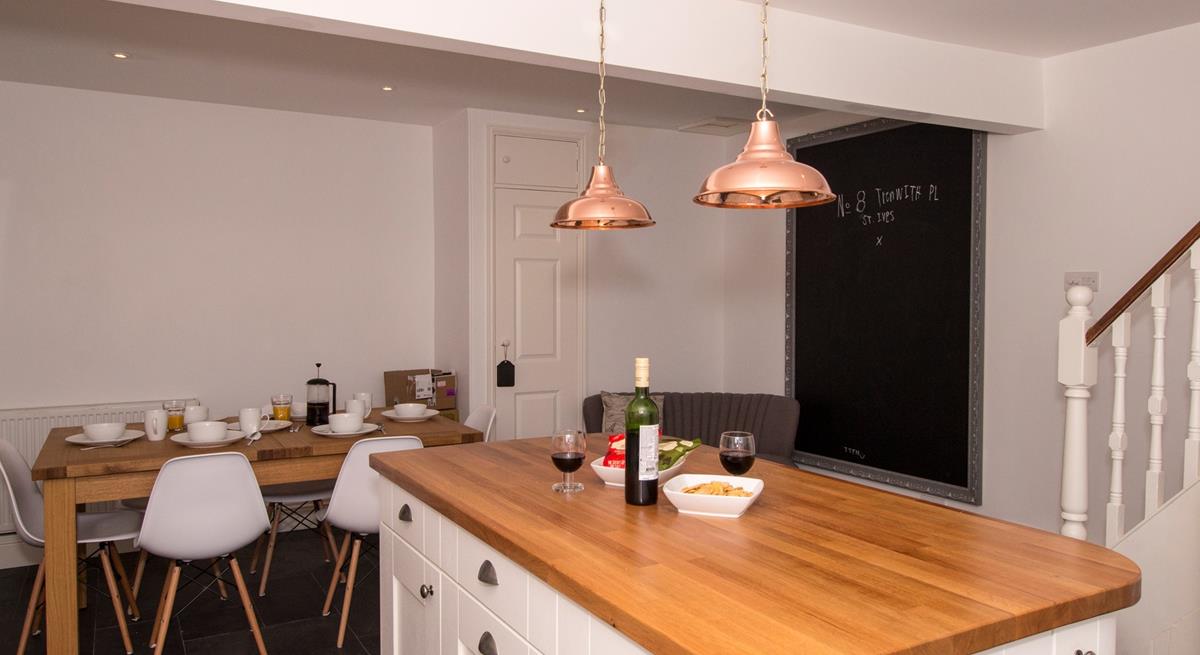 The open plan kitchen/dining area is a great space to entertain whilst dinner is cooking. 