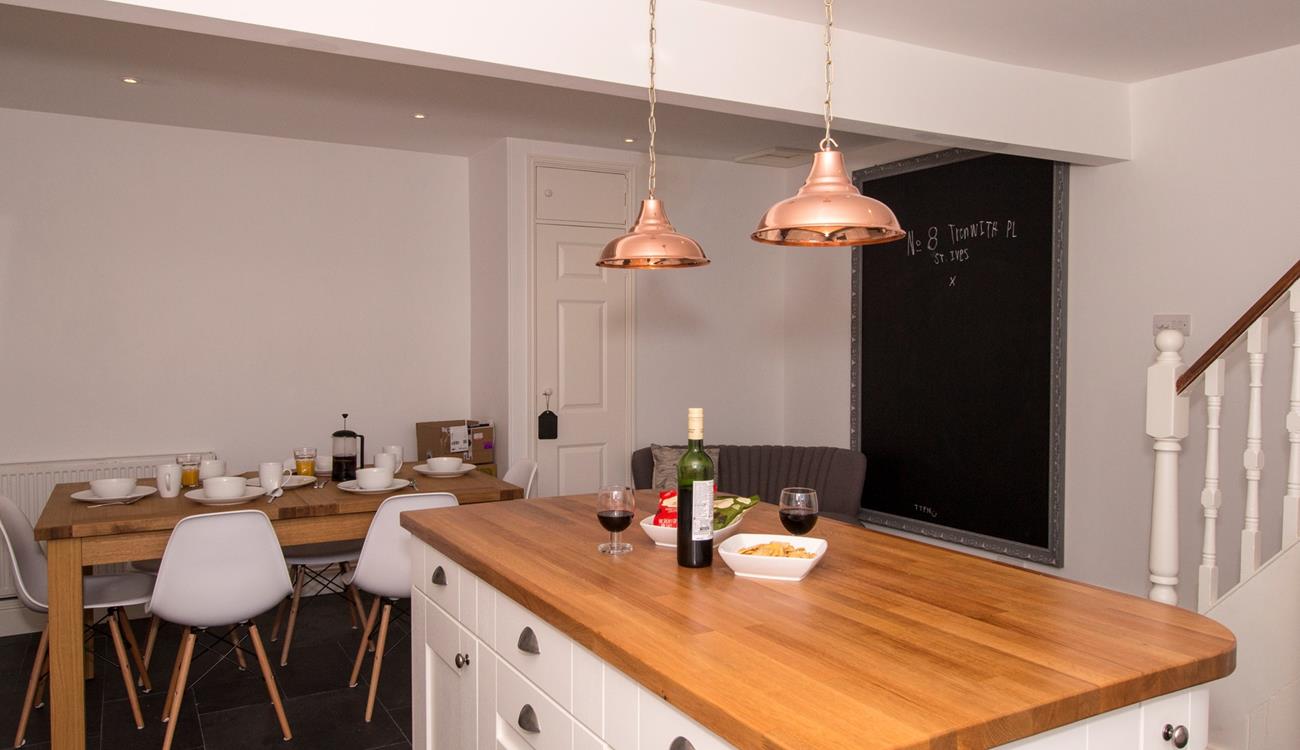 The open plan kitchen/dining area is a great space to entertain whilst dinner is cooking. 
