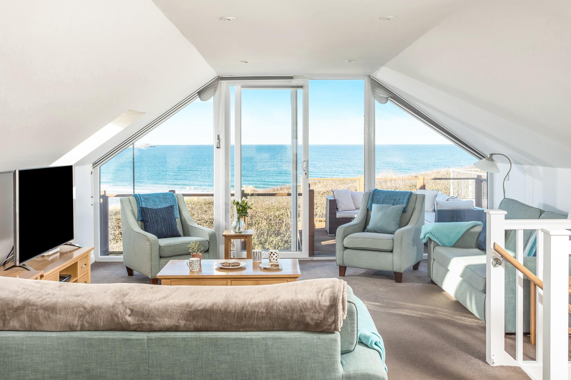 The comfortable open plan sitting room is perfectly positioned to take full advantage of the panoramic views.