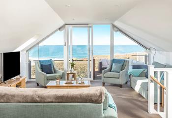 The comfortable open plan sitting room is perfectly positioned to take full advantage of the panoramic views.