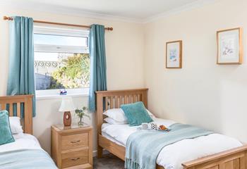 The twin beds are perfect for the kids to tuck into each night.