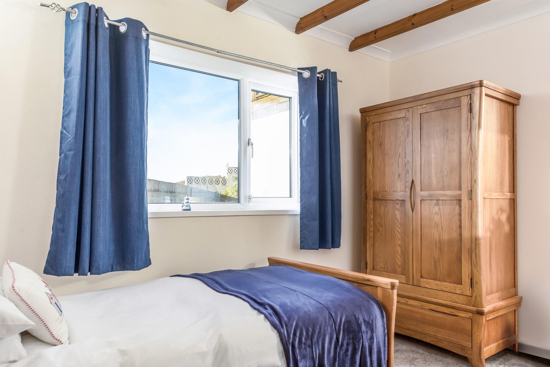 The deep blue decor reflects the close proximity to the ocean.