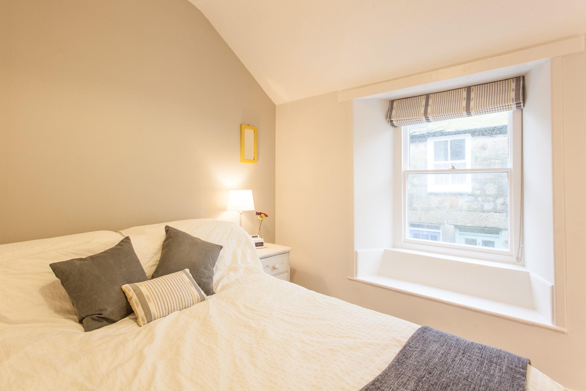 The king size bed offers a dreamy night's sleep after a busy day exploring Cornwall.