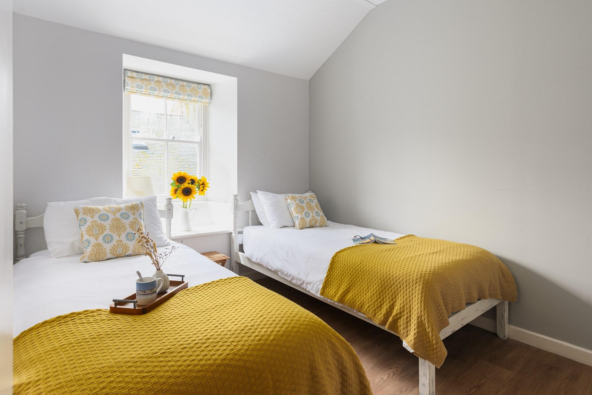 Bedroom 3 has twin beds, perfect for kids or adults to sink off for a restful night's sleep.