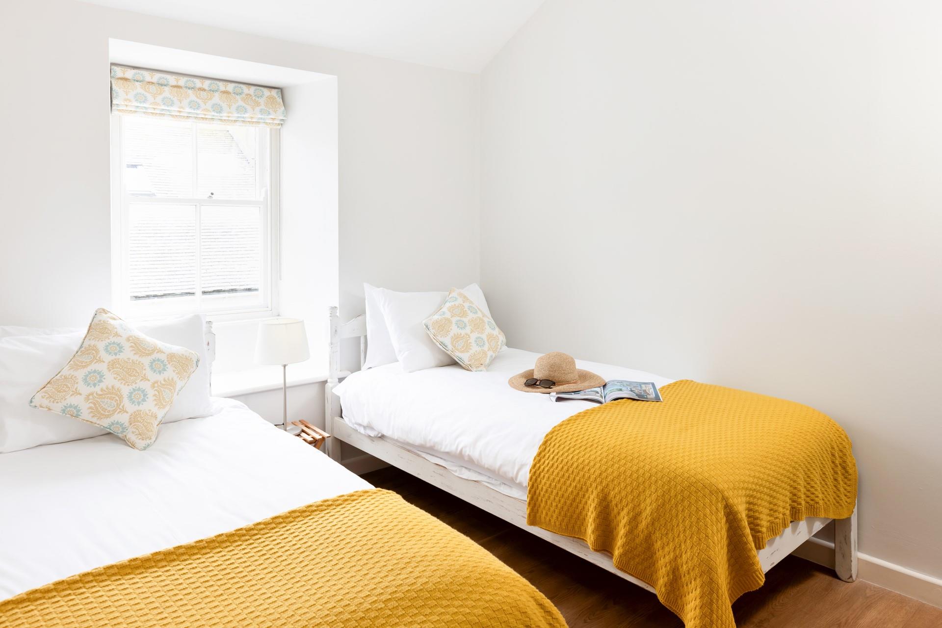 Bedroom 3 has twin beds, perfect for kids or adults to sink off for a restful night's sleep.