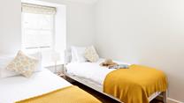 Bedroom 3 has twin beds, perfect for kids or adults to sink off for a restful night's sleep.