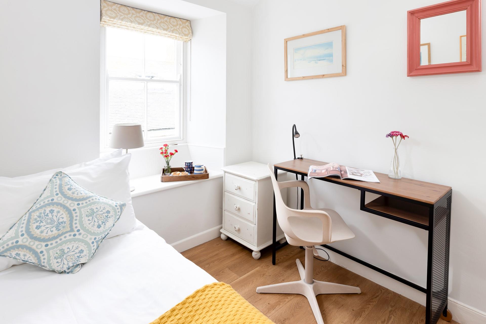 The desk is the perfect spot to open up a magazine or get ready for the day. 