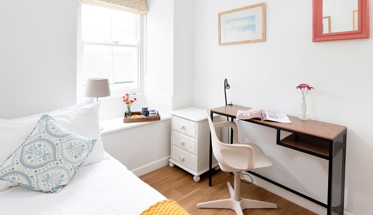 The desk is the perfect spot to open up a magazine or get ready for the day. 