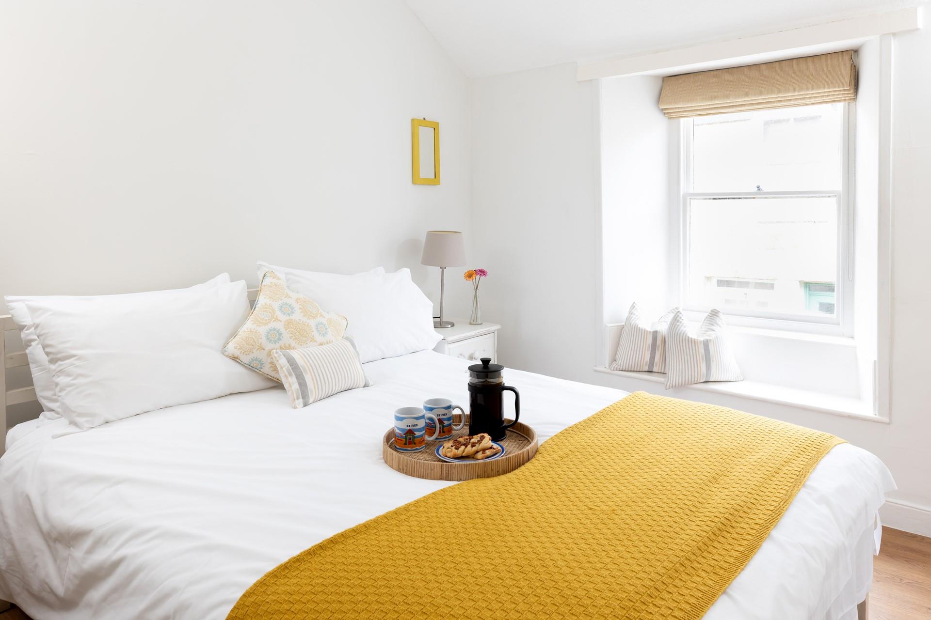 The king size bed offers a dreamy night's sleep after a busy day exploring Cornwall.