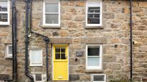 With it's bright yellow front-door, Saffron Cottage is easy to spot. 