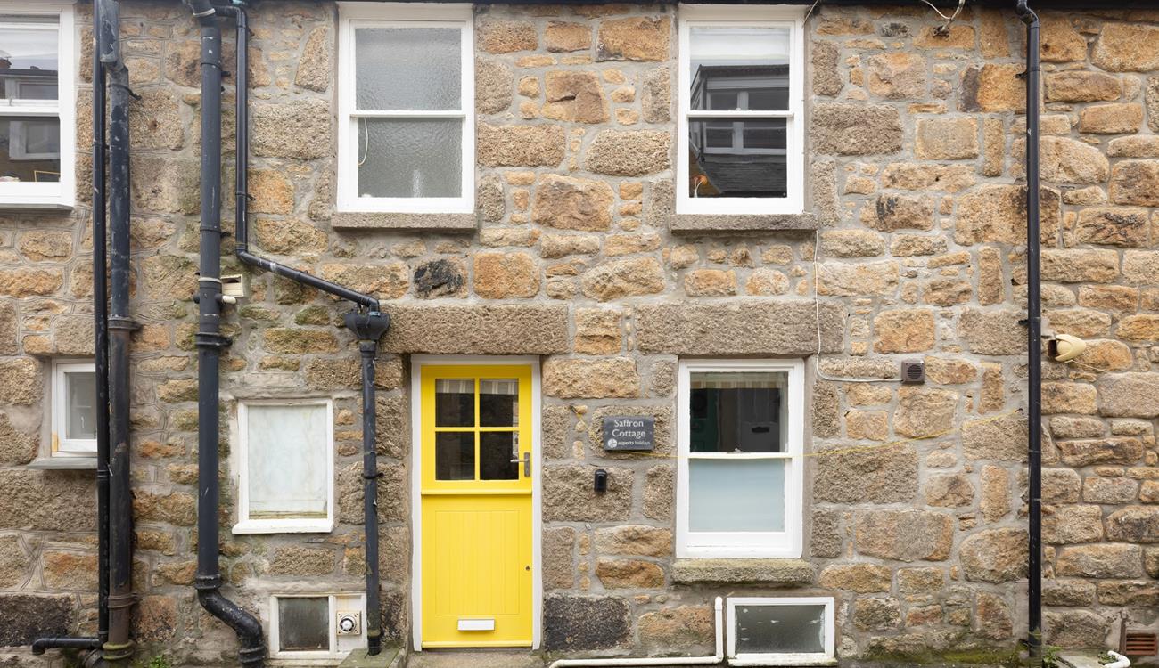 With it's bright yellow front-door, Saffron Cottage is easy to spot. 