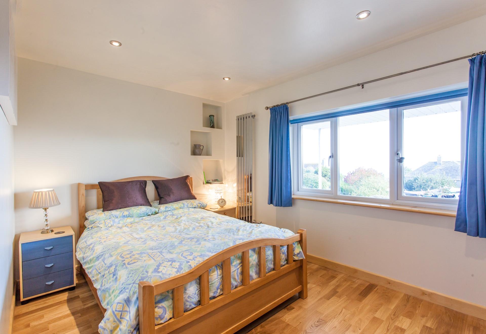 Wake up to dreamy sea views from the comfy double bedroom. 