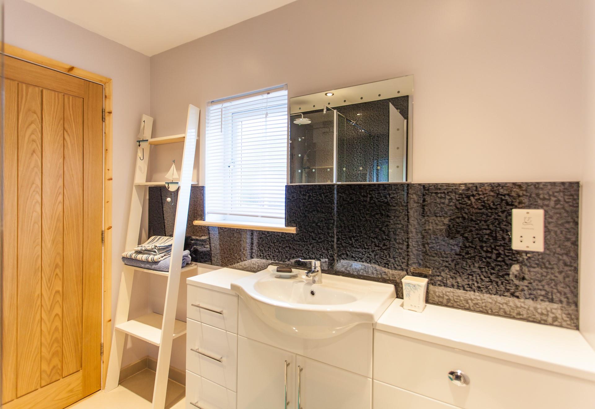 Get ready for your Cornish adventures in the spacious shower room. 