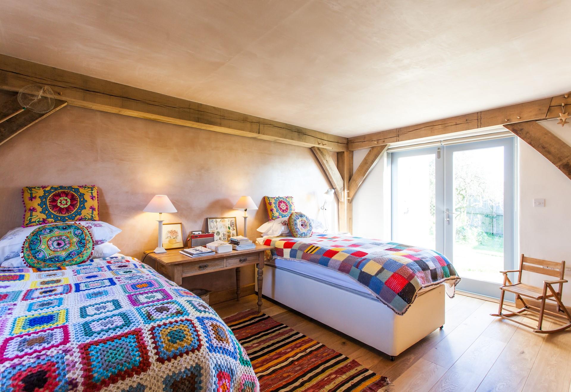 Colourful and comfortable, bedroom 2 has zip and link beds which can be made up as singles or a super king.