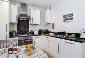 The kitchen is beautifully designed and fully kitted out with modern appliances to make cooking a breeze.