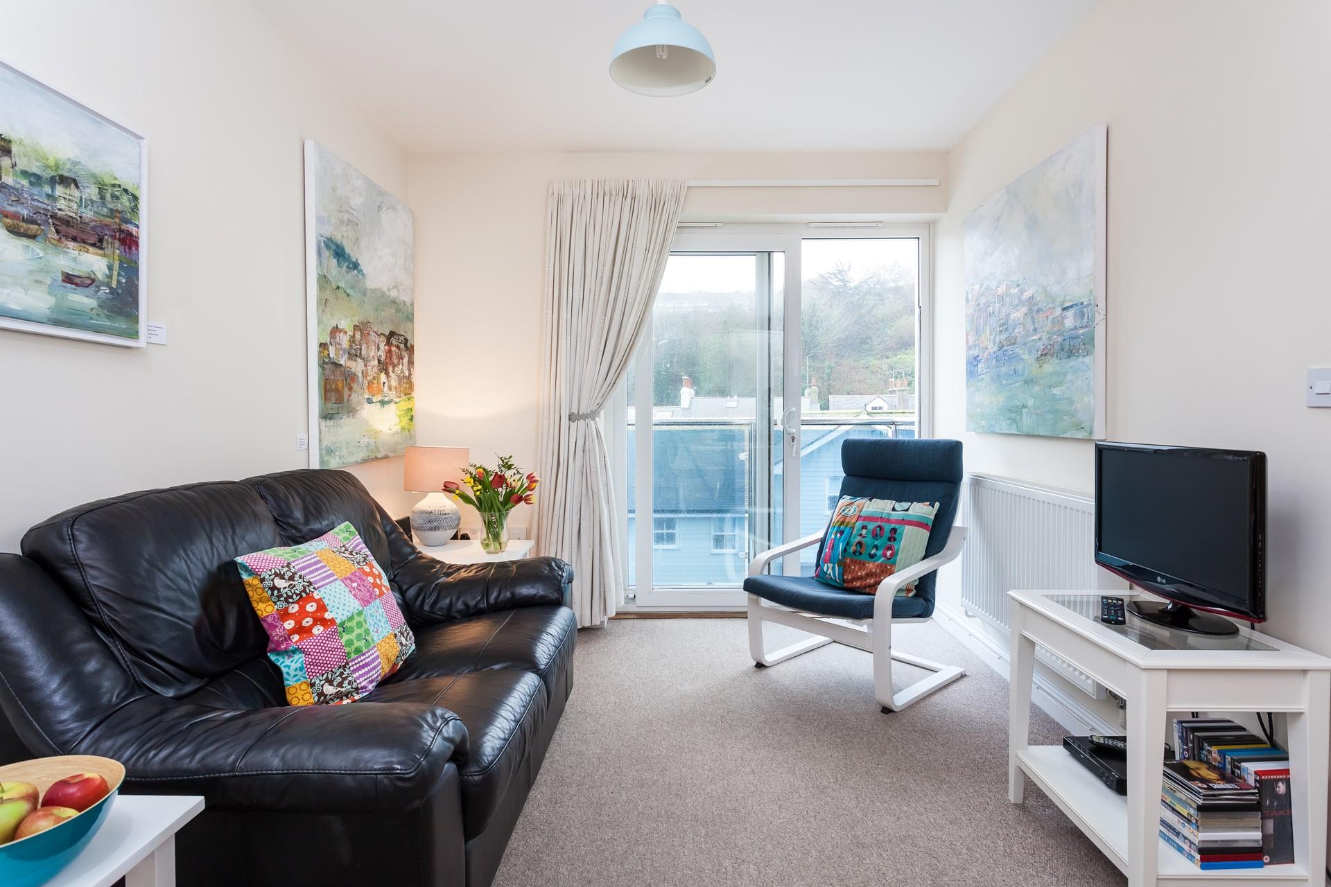 French doors to balcony from the open plan living room.