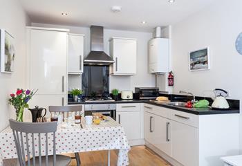 Cute and cosy, the open plan living offers ample space to relax.