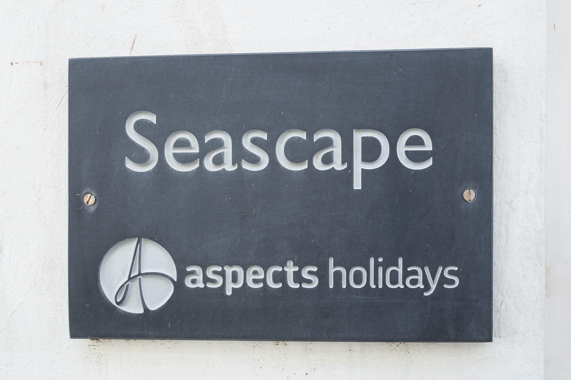 A classic Aspects Holidays slate sign helps make the property easy to find.