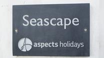 A classic Aspects Holidays slate sign helps make the property easy to find.