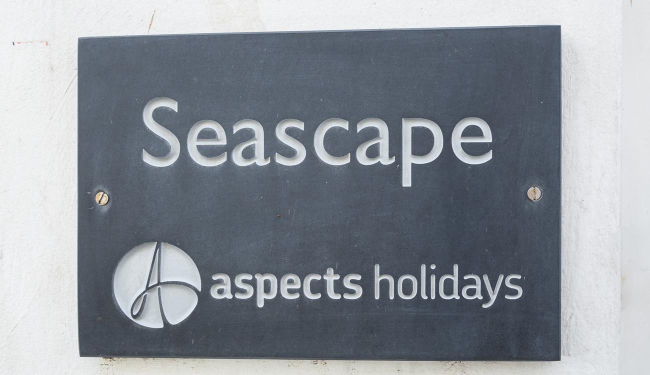 A classic Aspects Holidays slate sign helps make the property easy to find.