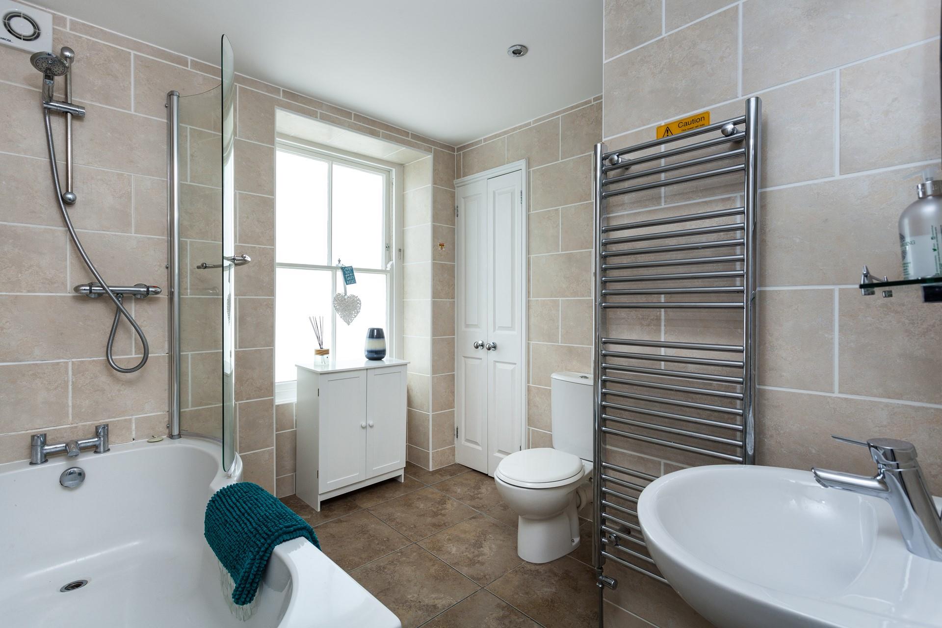 Take a hot bath and relax in the family bathroom.