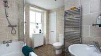 Take a hot bath and relax in the family bathroom.