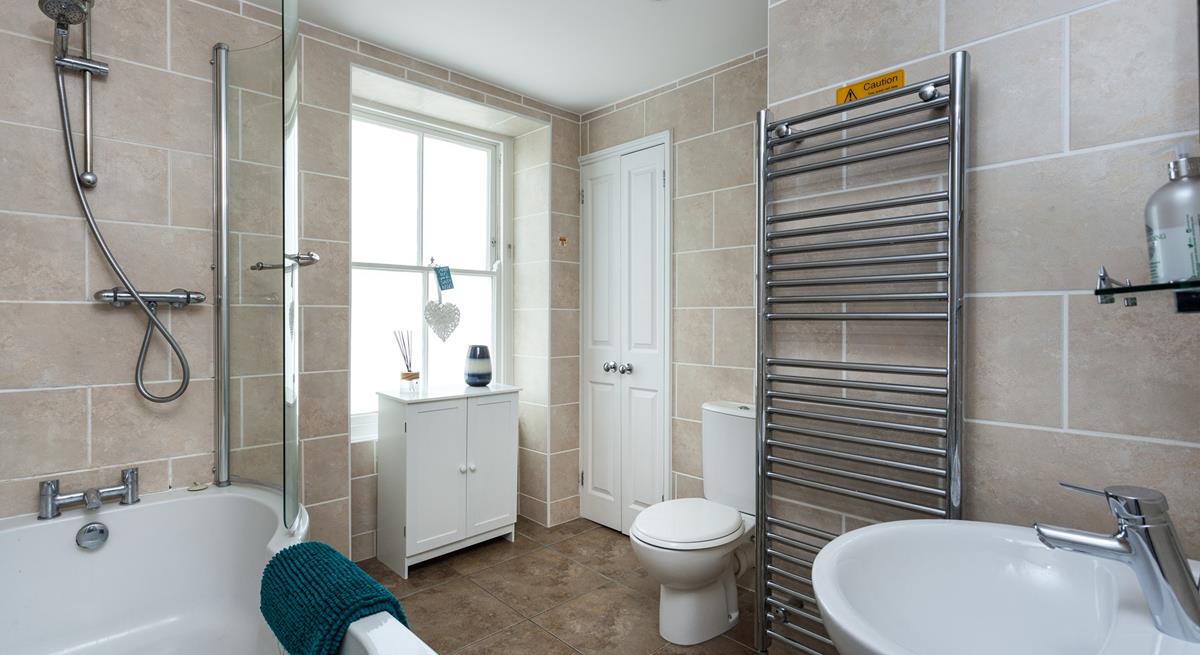 Take a hot bath and relax in the family bathroom.