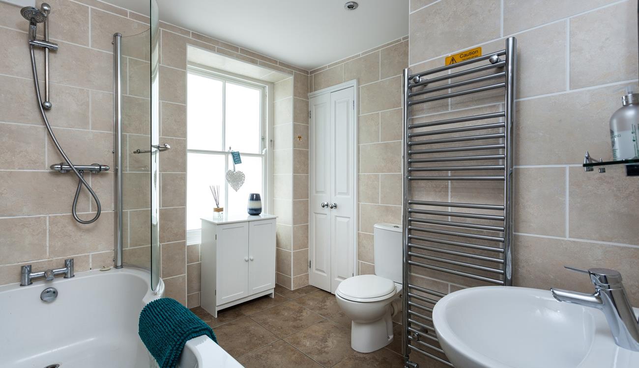 Take a hot bath and relax in the family bathroom.