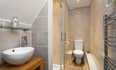 Sleek and stylish, the en suite is a lovely space to get ready for the day in. - Thumbnail Image