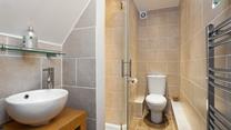 Sleek and stylish, the en suite is a lovely space to get ready for the day in.