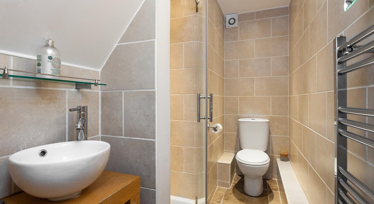 Sleek and stylish, the en suite is a lovely space to get ready for the day in.