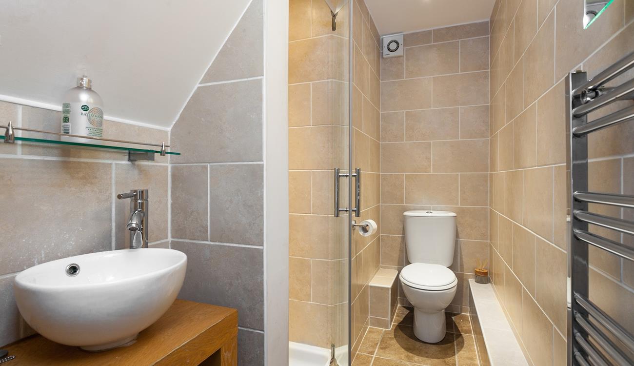 Sleek and stylish, the en suite is a lovely space to get ready for the day in.