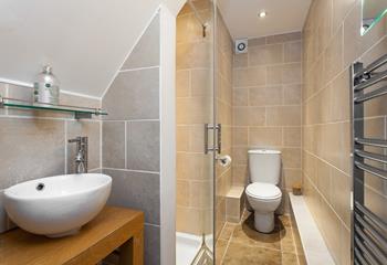 Sleek and stylish, the en suite is a lovely space to get ready for the day in.