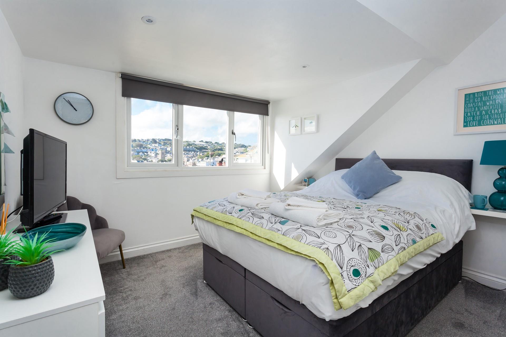 Sloping ceilings add extra character to this gorgeous house.