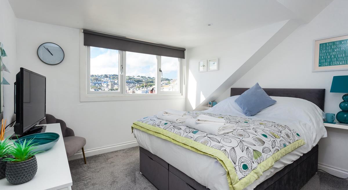 Sloping ceilings add extra character to this gorgeous house.