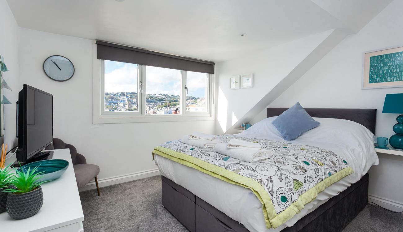 Sloping ceilings add extra character to this gorgeous house.