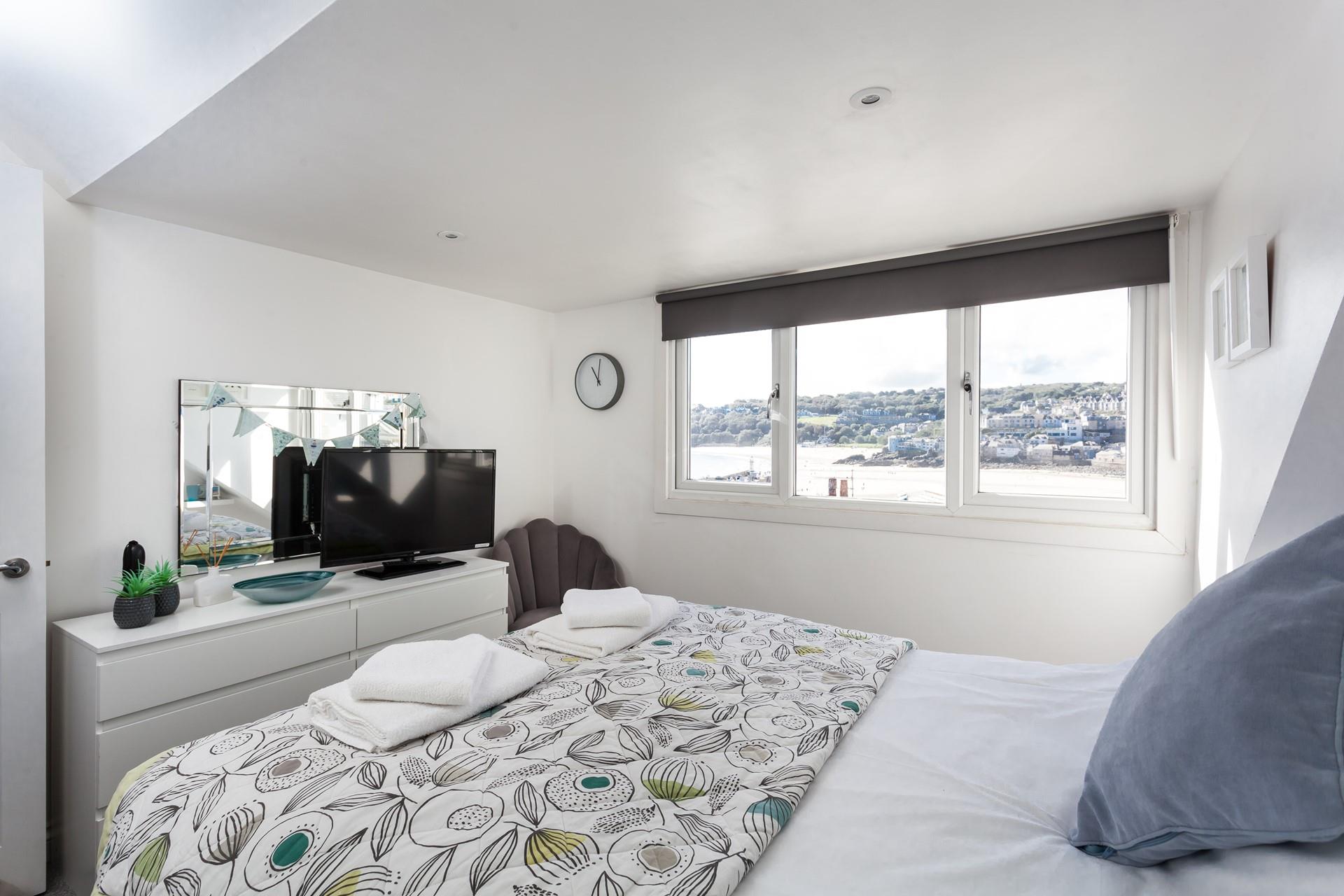 Fun decor and pops of colour bring the magic of the seaside indoors.