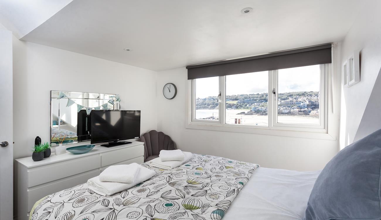 Fun decor and pops of colour bring the magic of the seaside indoors.