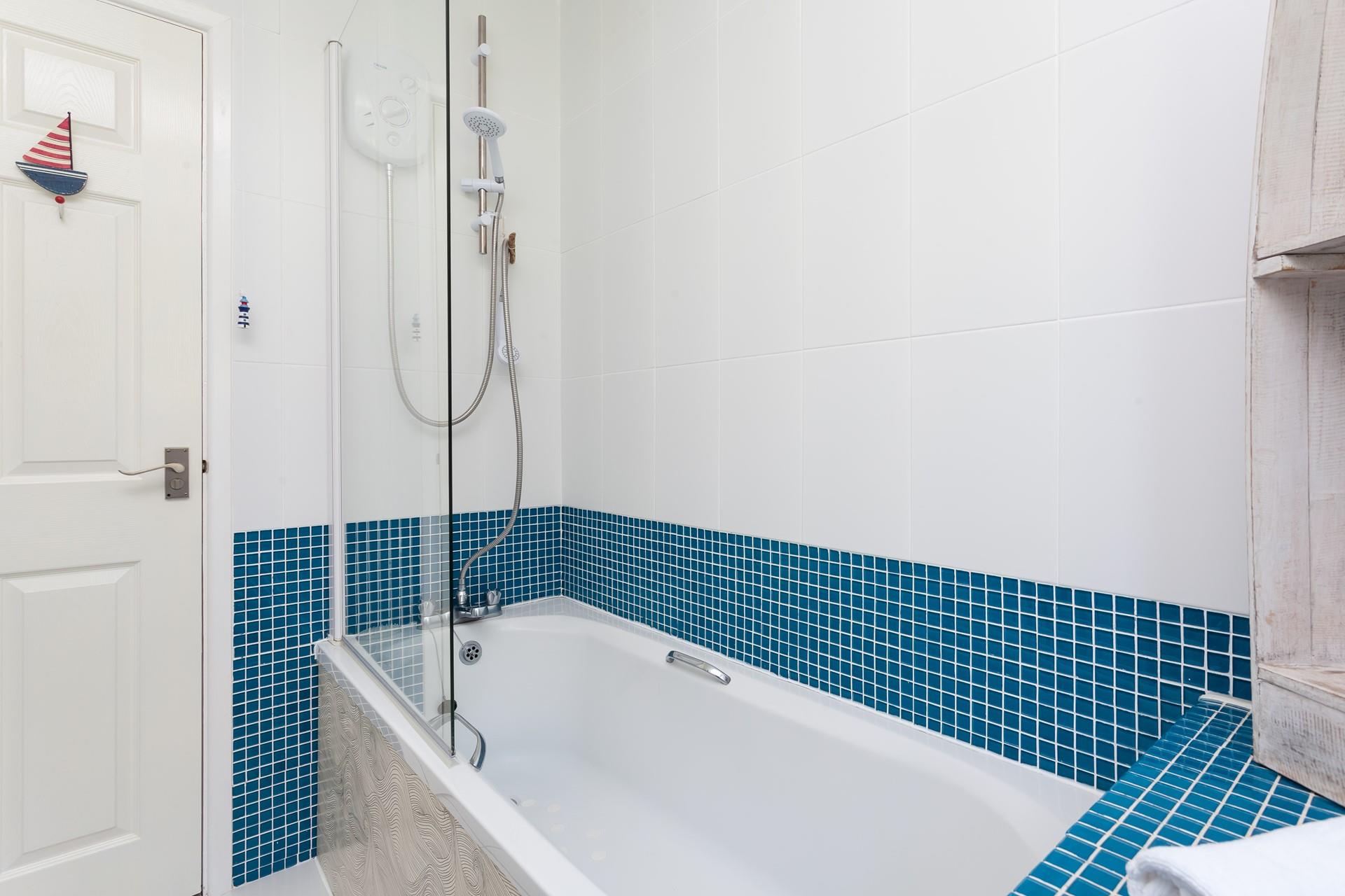 The family bathroom has a bath to relax and unwind in at the end of the day.