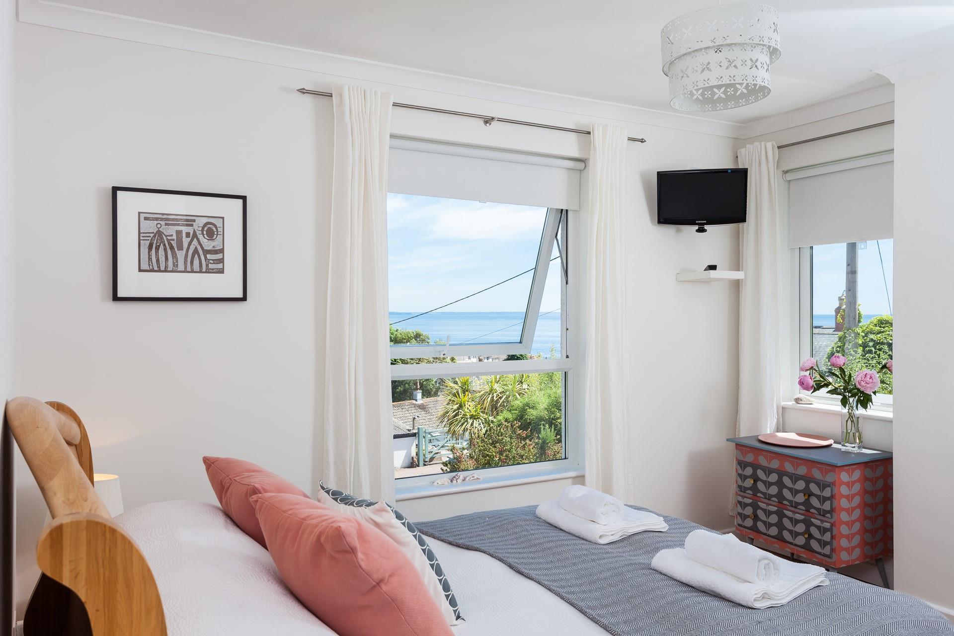 Wake up and open the curtains to stunning sea views.
