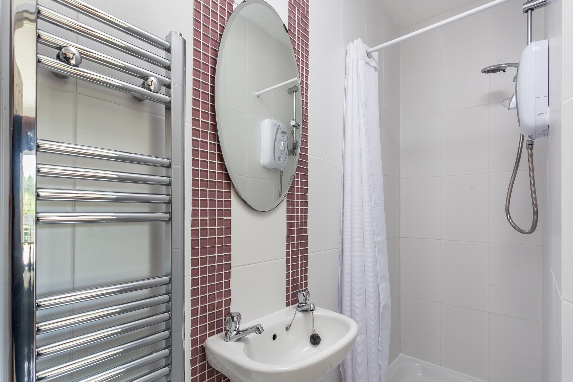 Wash off the sand from the day at the beach in the en suite shower room.