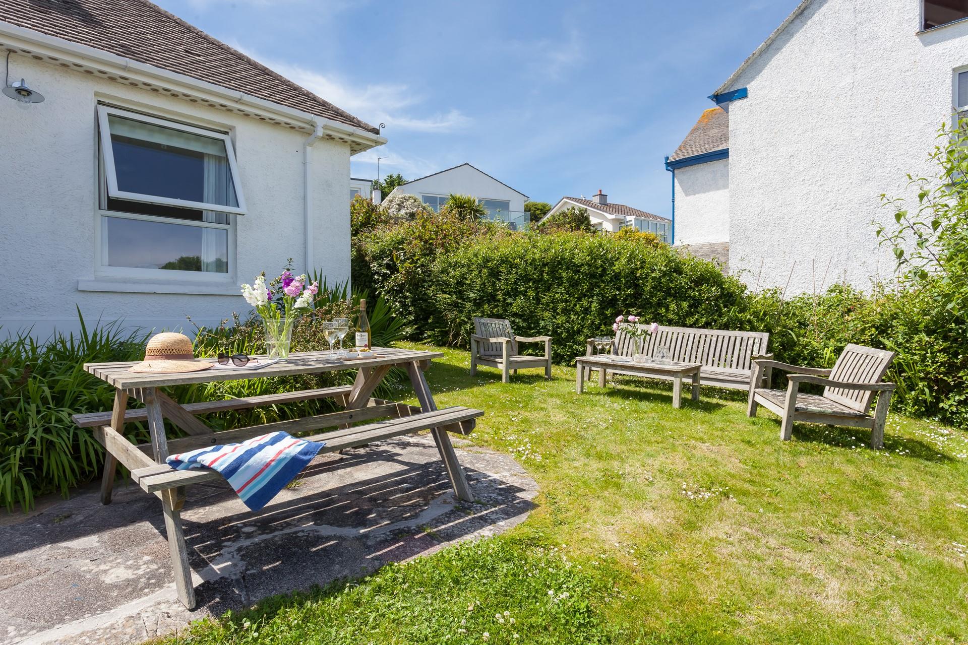 Open a bottle of wine and soak up the sun in your garden.