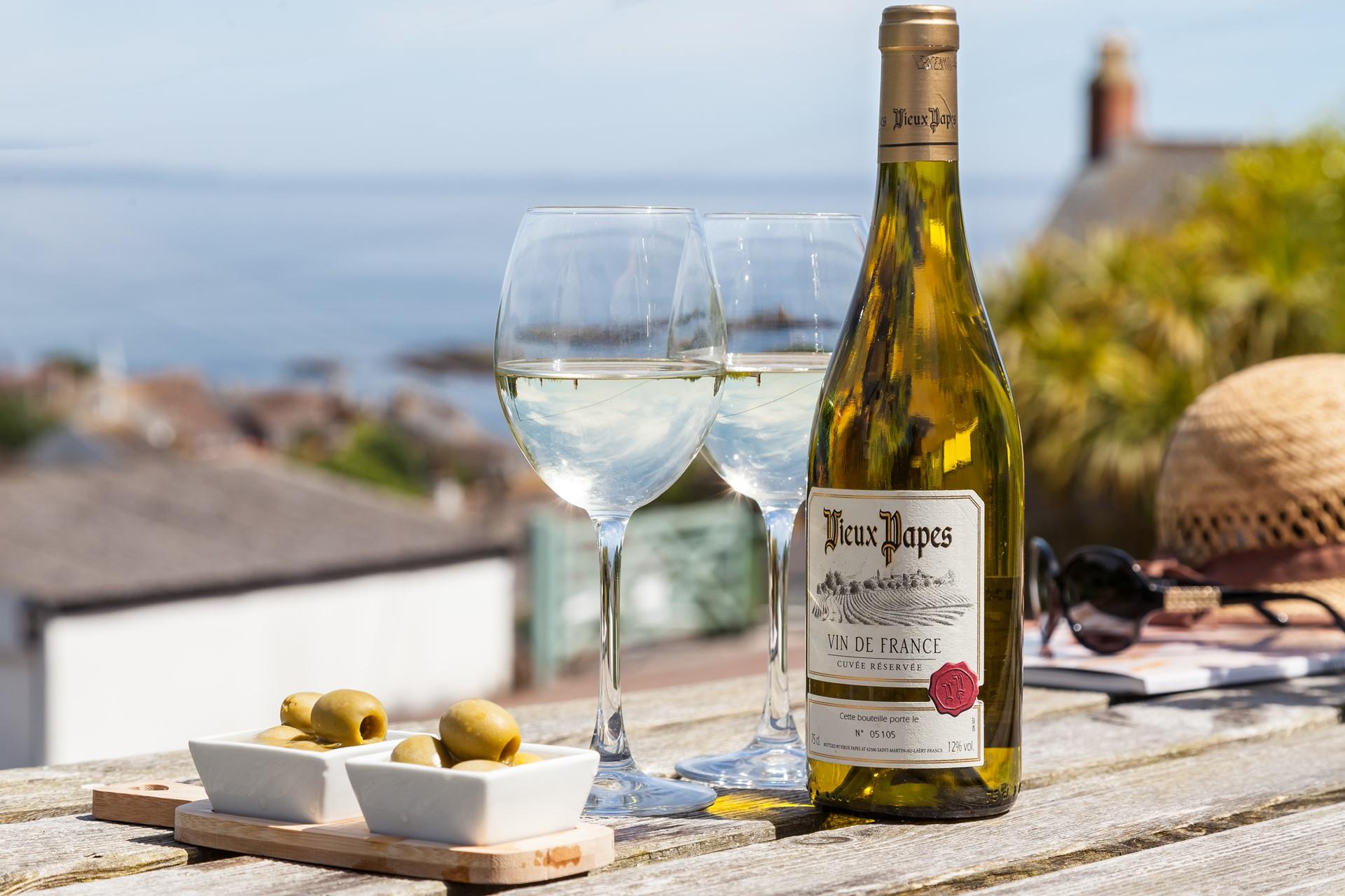 Relax on the terrace, enjoying the views across picturesque Mousehole.